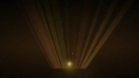 A bright golden light source emitting vertical rays into a dark atmosphere Video stock 335117782