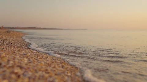 Bright golden waves at sunset on the beach. Stock Footage 295869948