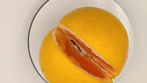 A bright grapefruit rotates smoothly Stock Footage 331887691