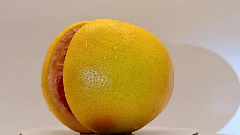 The bright grapefruit spins quickly Stock-Footage 331954272