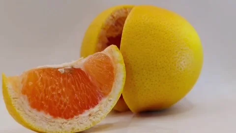 Bright grapefruit on a white background close-up Видео 331954194