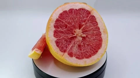 Bright grapefruit on white Stock Footage 331032578