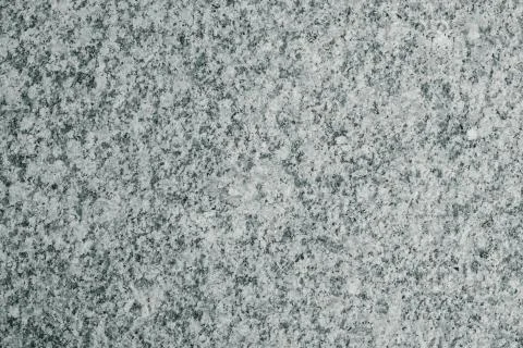 Bright gray background made of solid granite. Stock Photos