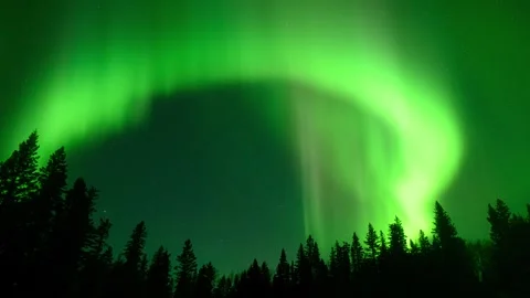 Bright green Aurora dance and curl in a sky full of stars Stock Footage 241099962