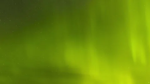 Bright green aurora spikes flash across the with stars in the background. Night Stock Footage 339733384