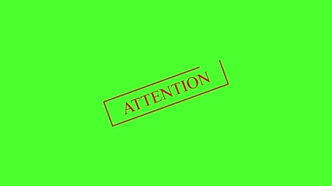 A bright green background with the word attention written in bold letters. .. Stock Footage 337567656