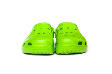 Bright green clogs isolated on white background Stock Photos