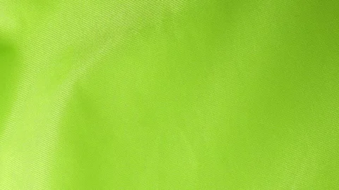 Bright green fabric texture with subtle diagonal weave pattern Stock Footage 336473030