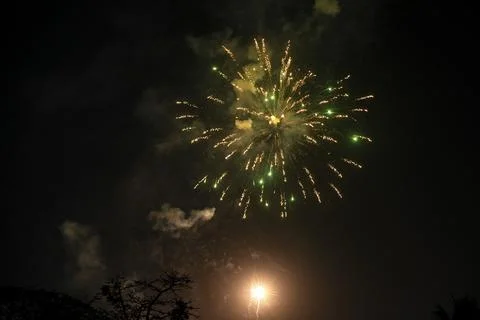 Bright Green Fireworks Exploding in the Night Sky During a Celebration Stock Photos