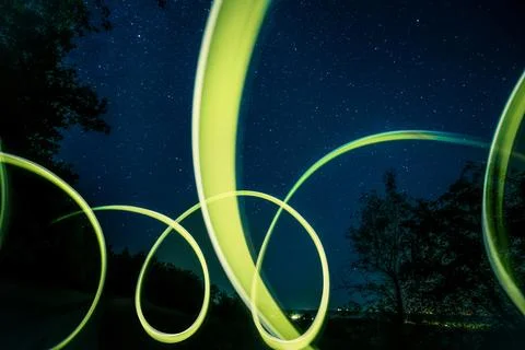 Bright Green Flashlight Trails Creating Vivid Glowing Lines In Darkness Stock Photos