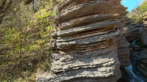 Bright green foliage frames rugged. Rosomac Canyon, Serbia Stock Footage 335535638