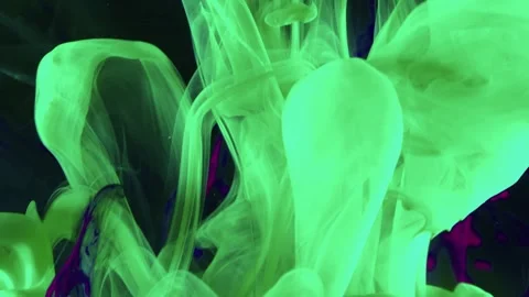Bright green paint dissolves in water creating abstract smoke effect Stock Footage 327572093