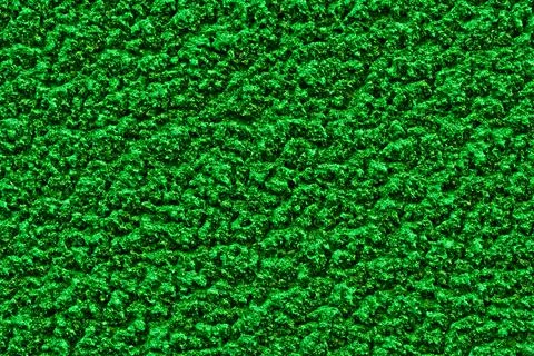 Bright green solid background with rough plaster texture. Stock-Fotos