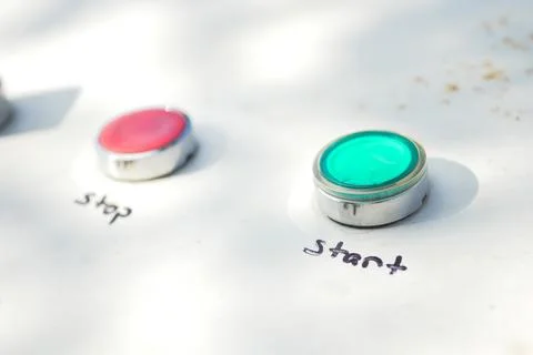 Bright green start button ready for action at outdoor event Stock Photos