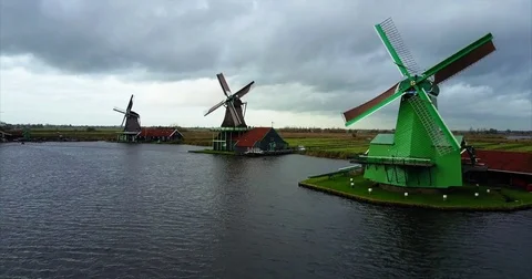 Bright green timber mill on a grassed spit by the water Video stock 71288904