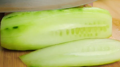 The bright green vegetable is prepared carefully for a healthy meal or salad. 動画素材 341558049
