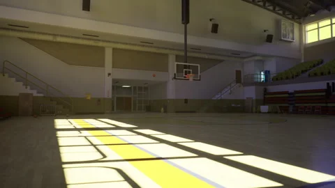 Bright gym interior with silhouettes and artistic shadow play Stock Footage 340663731