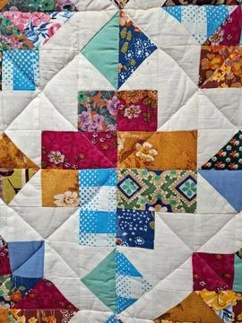 Bright handmade patchwork quilt with geometric star pattern made from vario.. Stock-Fotos