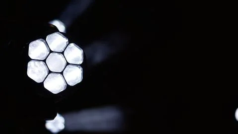 Bright hexagonal led light array against dark background Foto stock