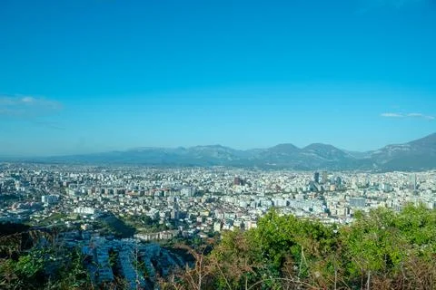 A bright, high-angle view of the densely built Tirana, Albania cityscape Stock Photos