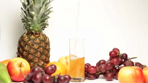 Bright high quality video of fresh multivitamin juice being poured into gla.. Stock Footage 233437410