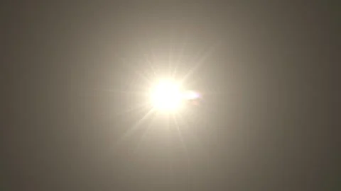 Bright High Sunlight and Lens Flare in a Clear Sky Overhead Stockbeeldmateriaal 340412024