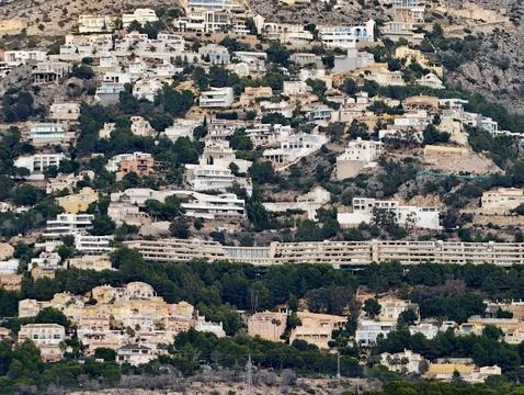 Bright hillside villas, Charming hillside residences surrounded by gardens and Stock Photos