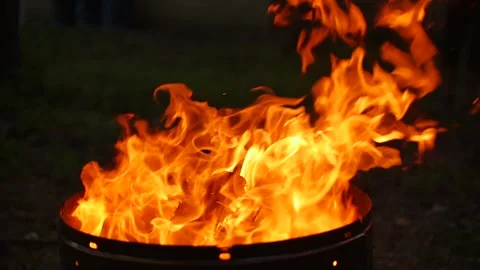 Bright hot flames in a fire in a burning brazier or barbecue Stock Footage 152366098