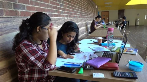 Bright Indian students discuss math problem at campus Singapore university Stock Footage 78464746