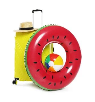 Bright inflatable ring, ball, suitcase and straw hat on white background 스톡 사진