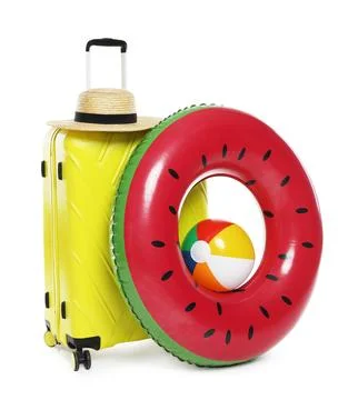 Bright inflatable ring, ball, suitcase and straw hat on white background 스톡 사진