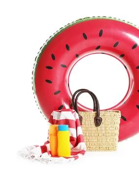 Bright inflatable ring, beach blanket, bag and sunscreens isolated on white 스톡 사진