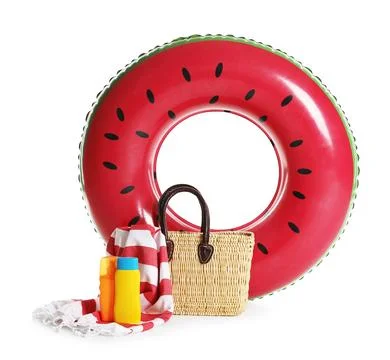 Bright inflatable ring, beach blanket, bag and sunscreens isolated on white 스톡 사진