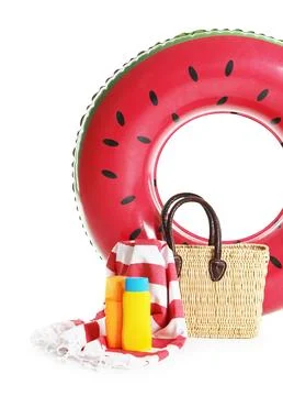 Bright inflatable ring, beach blanket, bag and sunscreens isolated on white 스톡 사진