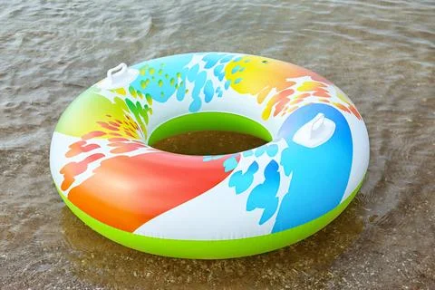 Bright inflatable ring floating on sea water. Summer vacation 스톡 사진
