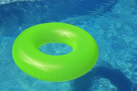 Bright inflatable ring floating in swimming pool on sunny day. Space for text 스톡 사진