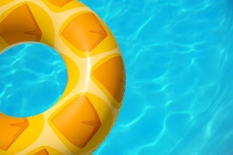 Bright inflatable ring floating in swimming pool on sunny day. Space for text Stock Photos