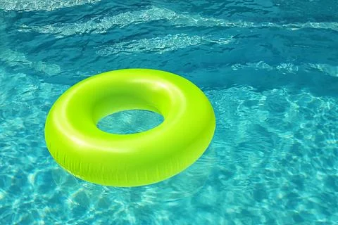 Bright inflatable ring floating in swimming pool on sunny day. Space for text Stock-Fotos