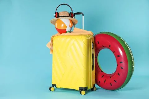 Bright inflatable ring, other different accessories, headphones and suitcas.. 스톡 사진