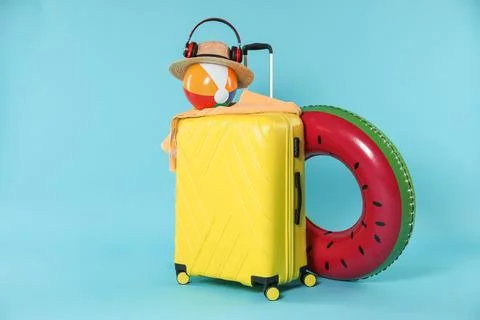 Bright inflatable ring, other different accessories, headphones and suitcas.. 스톡 사진