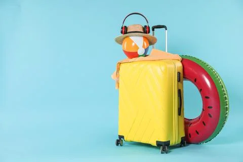 Bright inflatable ring, other different accessories, headphones and suitcas.. 스톡 사진