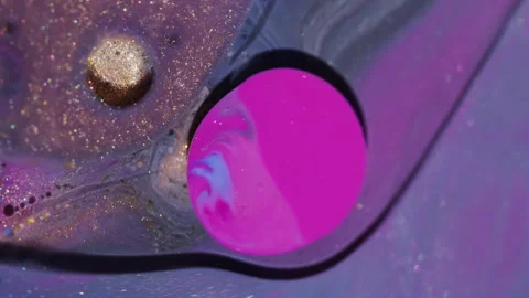 Bright ink stream shimmer bubble glitter oil water Stock Footage 329280836