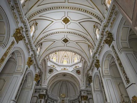Bright interior of a cathedral with white ceiling and gold details showcasi.. Stock-Fotos