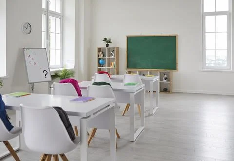 Bright interior of empty classroom without students in modern elementary school. Stock Photos