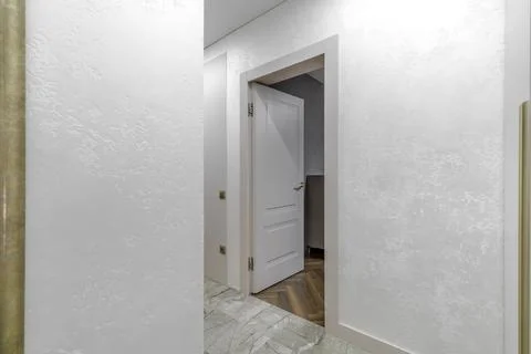 Bright Interior Hallway with Open Classic White Door Stock Photos