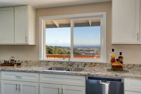 Bright interior of kitchen with white cabinets  Stock Photos