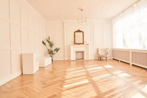Bright interior with large windows and a fireplace in a classic style. Large Stock Photos