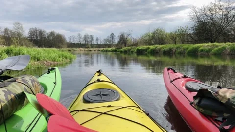 Bright Kayaks on the River. River rafting. Active lifestyle Stock Footage 130577509