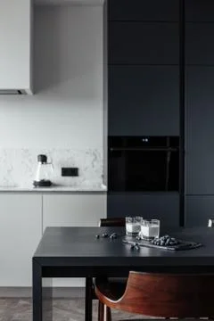 Bright kitchen with dark table, convenient location of kitchen accessories and Фото