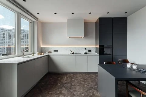 Bright kitchen with dark table, convenient location of kitchen accessories and Фото